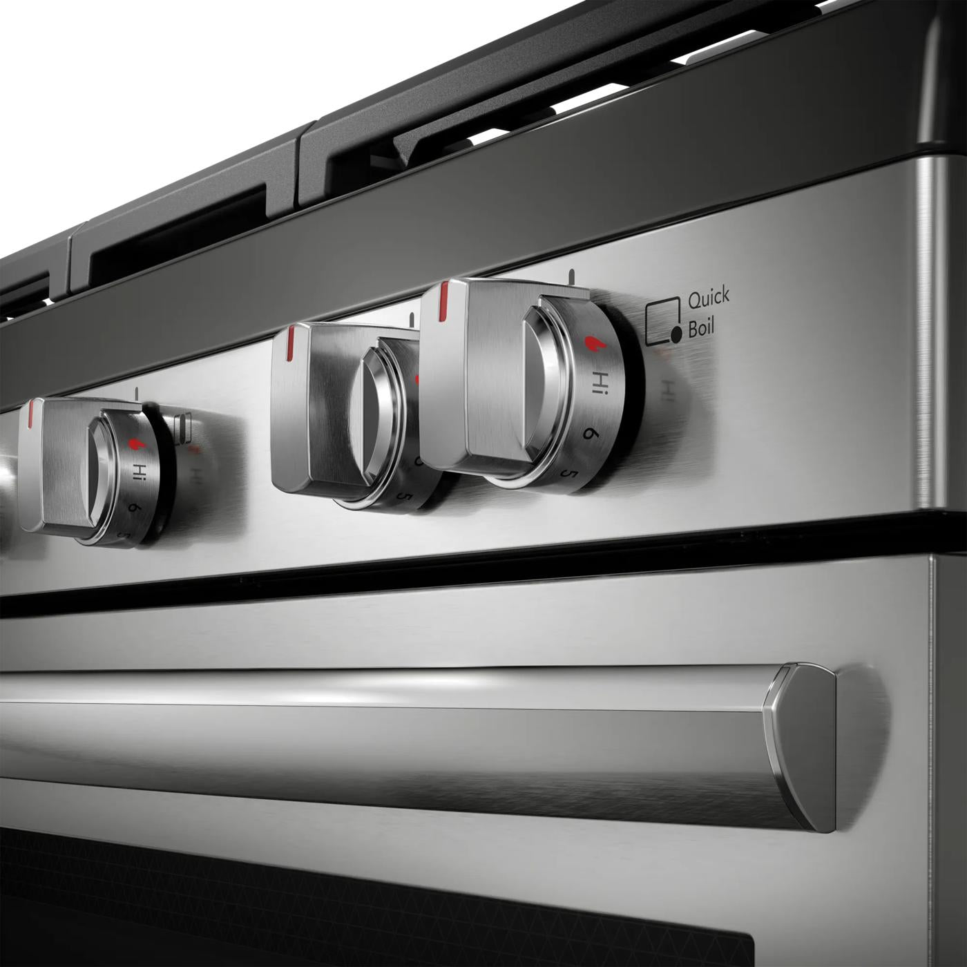 Close-up of stainless steel gas range burner control knobs with quick boil feature from kitchen appliances collection