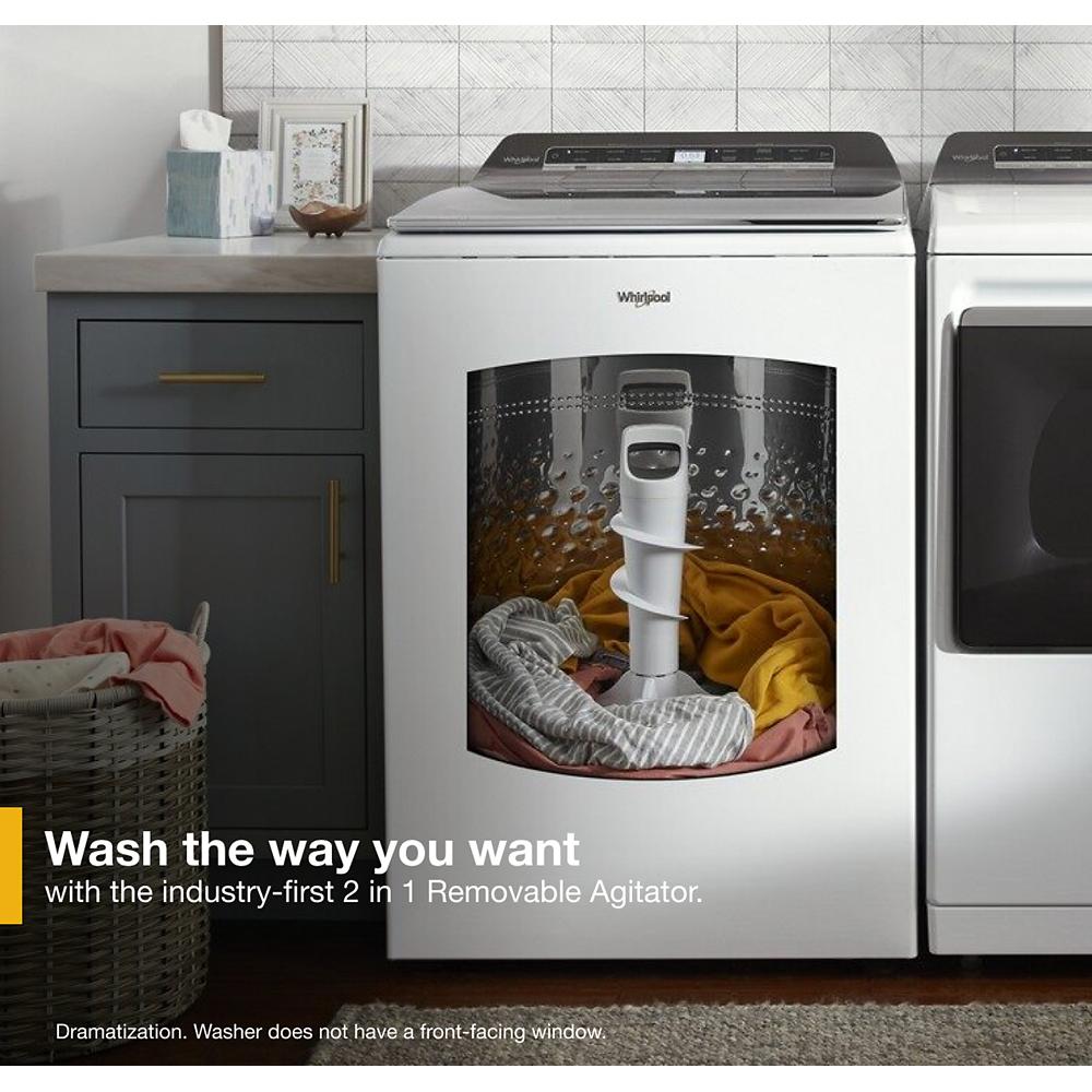 White top load washer with 2 in 1 removable agitator shown with household laundry in modern laundry room setting