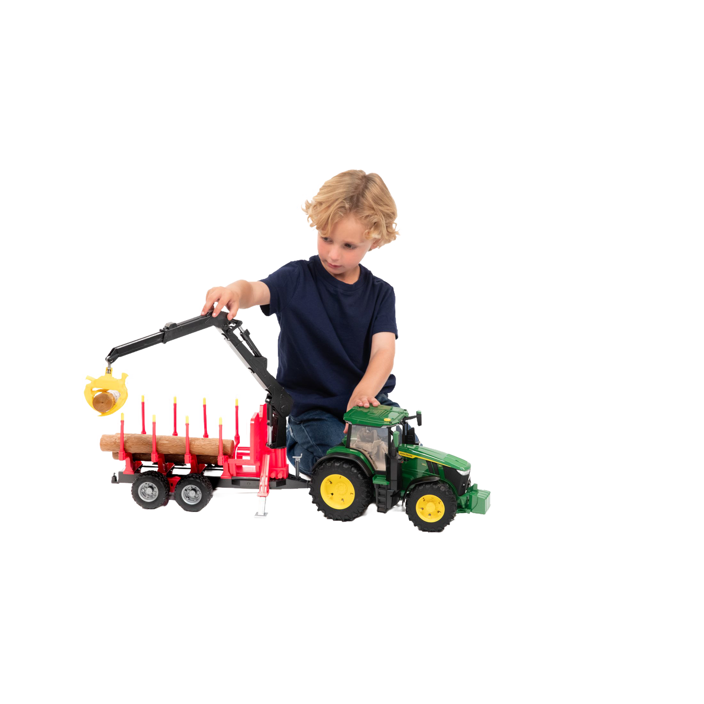Child playing with green and yellow Bruder John Deere 7R 350 tractor and red forestry trailer toy in Vehicles & Remote Controlled Toys collection