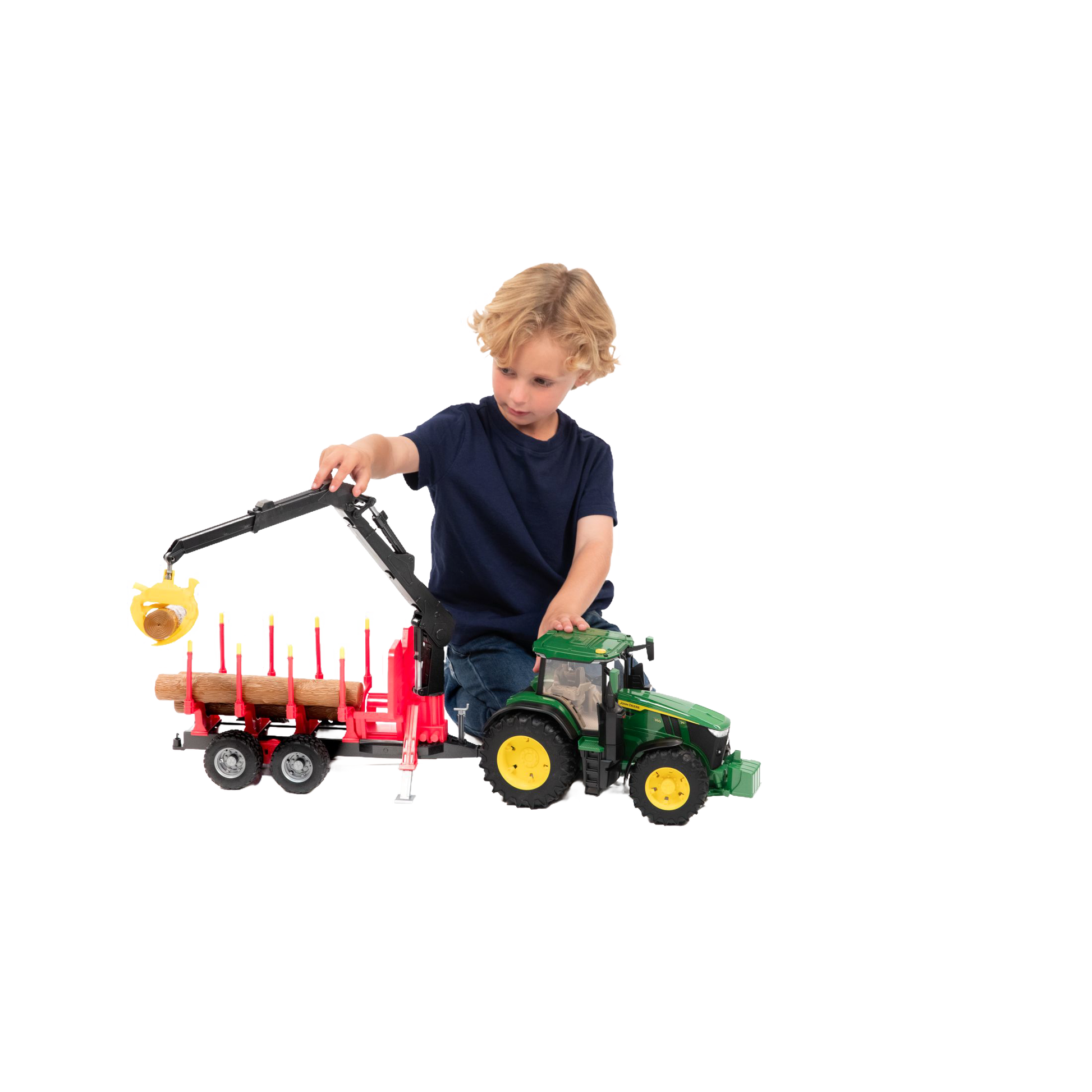 Child playing with green and yellow Bruder John Deere 7R 350 tractor and red forestry trailer toy in Vehicles & Remote Controlled Toys collection