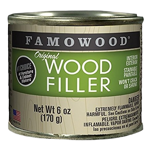 Small metal can of ash-colored wood filler for interior and exterior home improvement projects