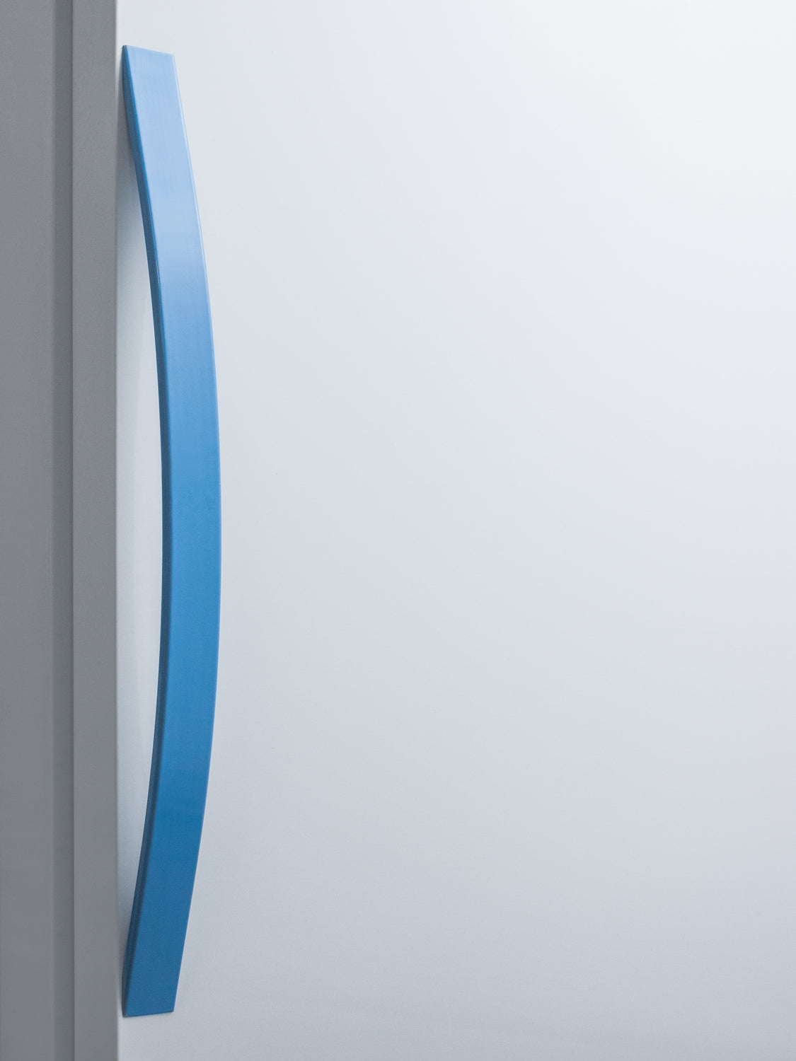 Close-up of curved blue handle on white 15 Cu.Ft. upright laboratory refrigerator door in Appliances collection