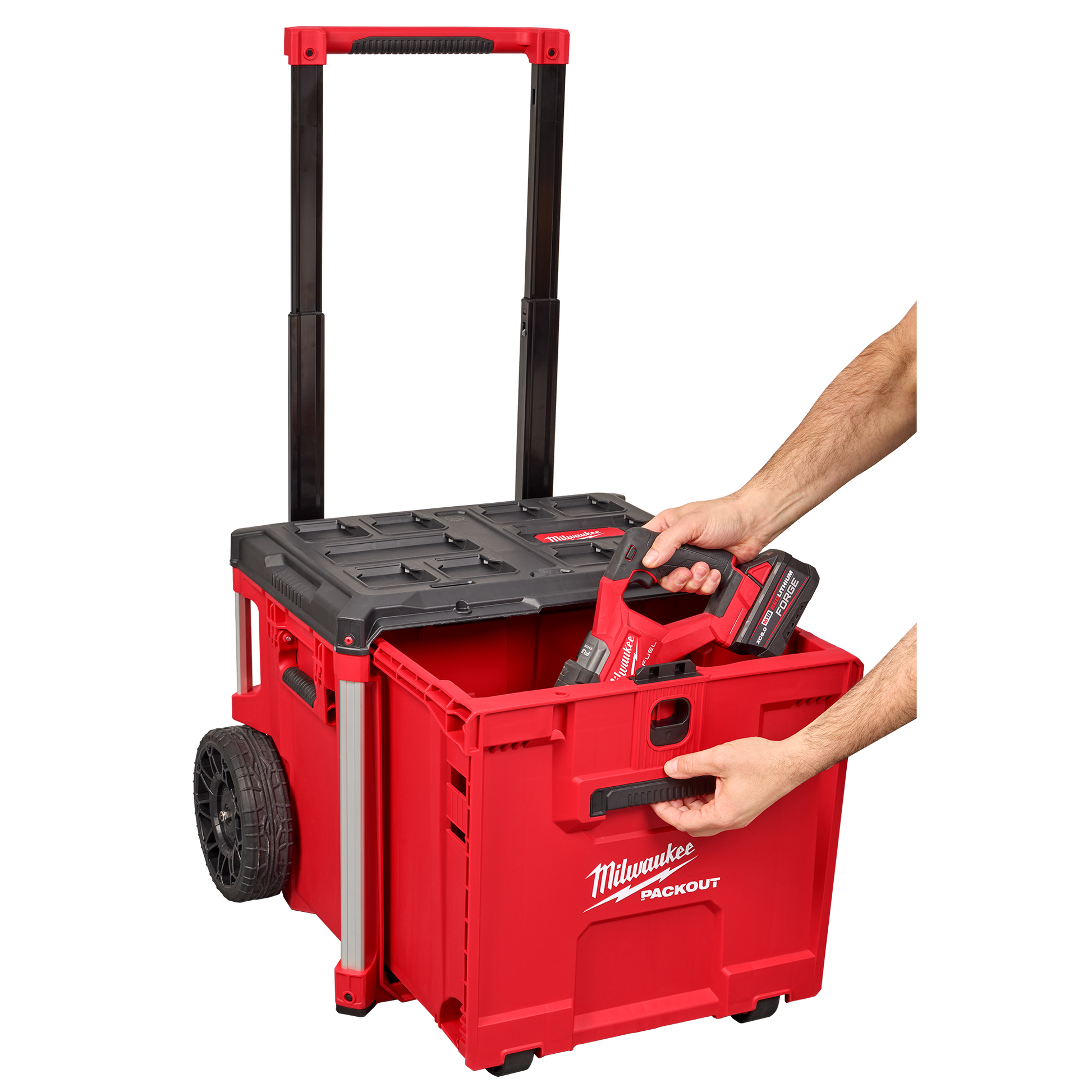 Red Milwaukee PACKOUT™ rolling drawer tool box with extendable handle and large wheels for tool storage and organization