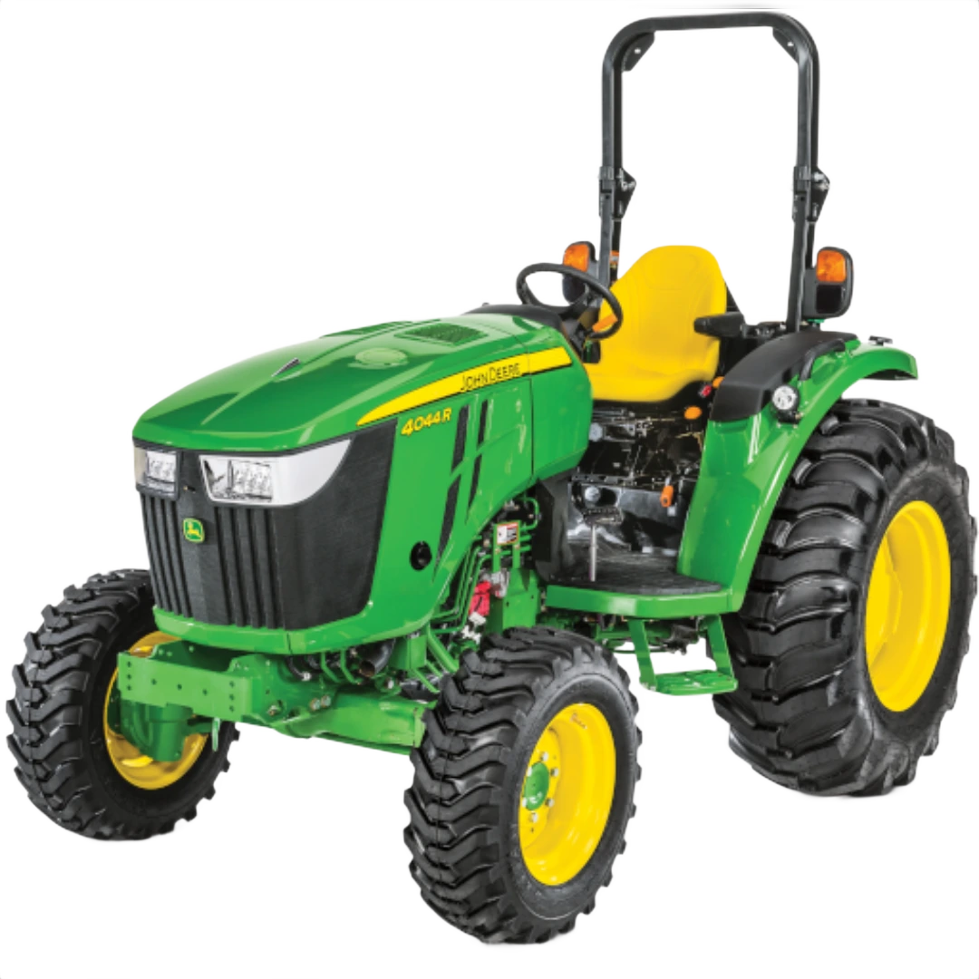 Green and yellow compact tractor with rollover bar, rugged tires, and open operator seat, featured in Outdoor Power Equipment at Hartville Hardware.