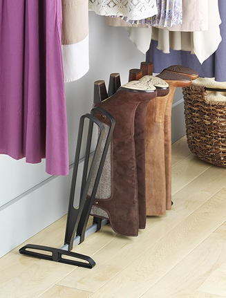Black boot rack holding three pairs of boots for closet organization in Storage & Organization and Closet Accessories collections