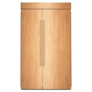 Built-in panel-ready side-by-side refrigerator with wood panel exterior and vertical handles in KitchenAid appliances collection