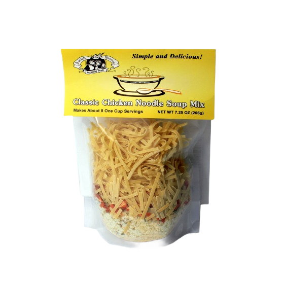 Clear pouch with yellow label containing dry noodles and seasoning for chicken noodle soup mix