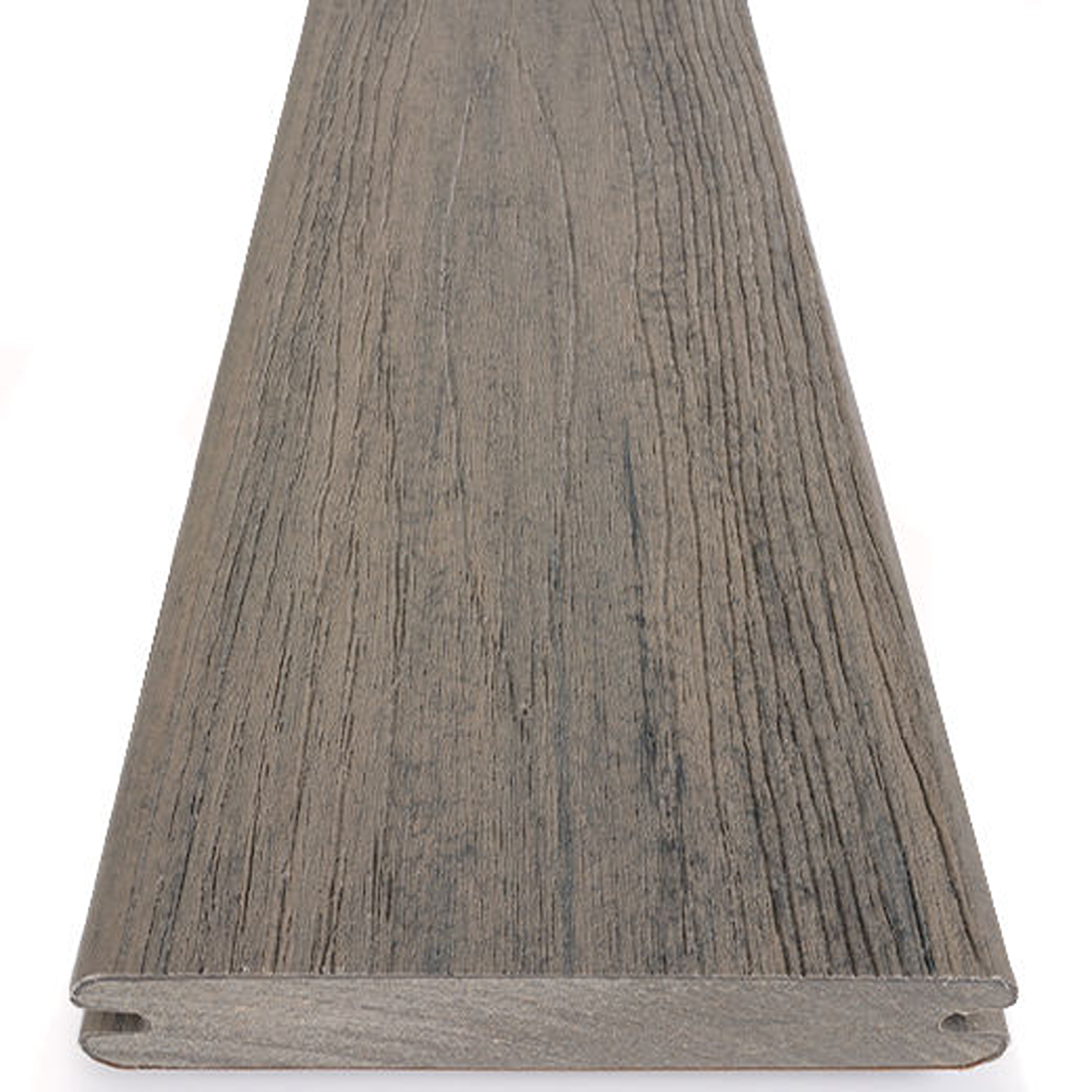Grooved composite deck board in driftwood color with textured woodgrain finish for home improvement projects