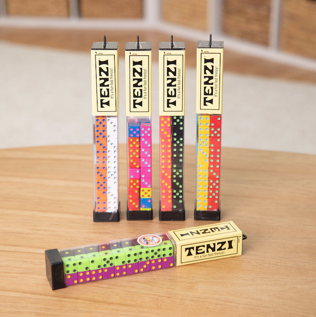 Variety of colorful Tenzi Dice Game sets displayed in clear tubes for quick and energetic gameplay in Toys & Games collection