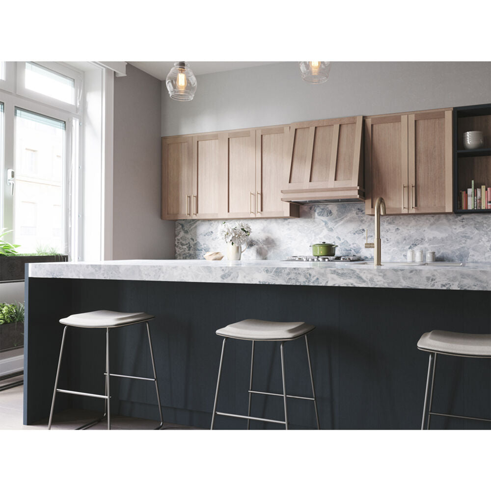 Modern kitchen with wood cabinetry, marble countertop island, bar stools, and a built-in range hood from range hoods collection