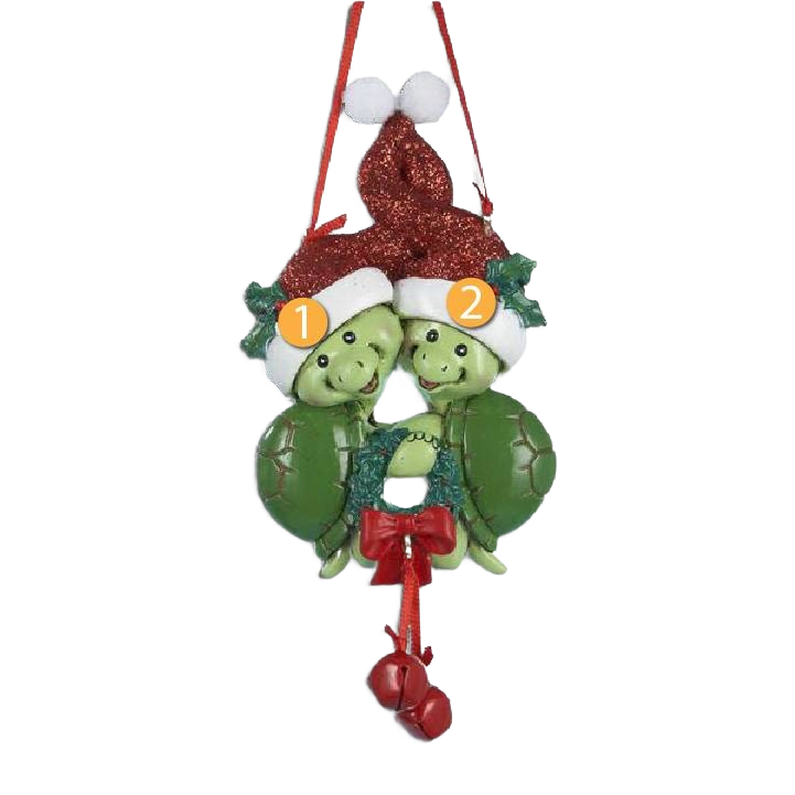 Green resin turtle ornament with two turtles wearing red Santa hats and holding a festive wreath under $50