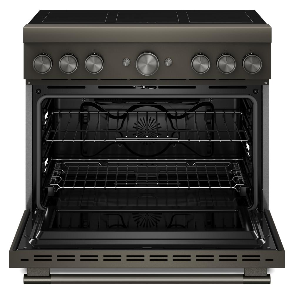 Open freestanding 36-inch commercial-style induction range with six control knobs and oven racks in dark finish