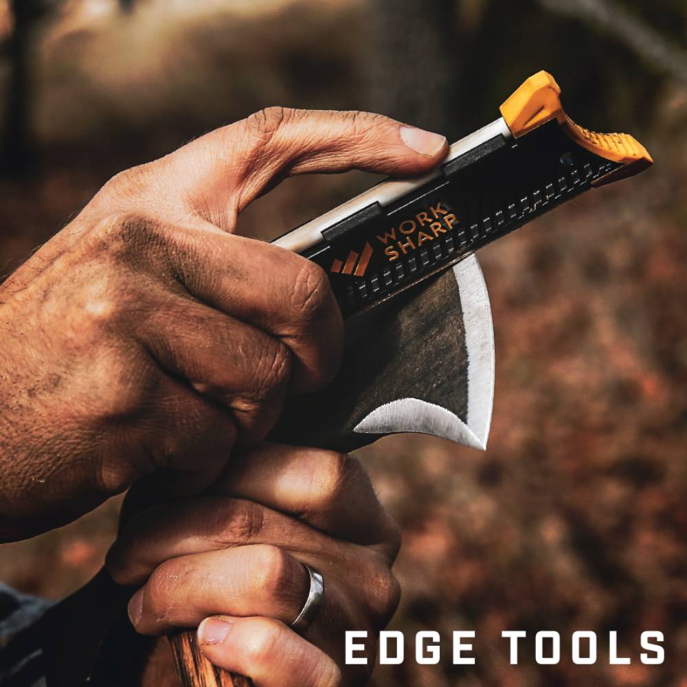 Person sharpening a curved blade with a compact black and orange handheld sharpener for woodworking and kitchen tools under $50