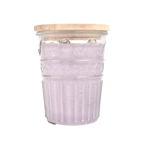 Glass jar candle with textured lavender wax and natural wooden lid for home decor and relaxation ambiance