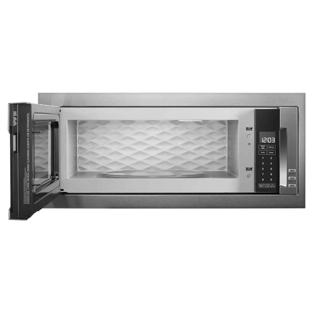 Built-in low profile microwave with open door, digital control panel, and textured stainless steel interior from KitchenAid collection