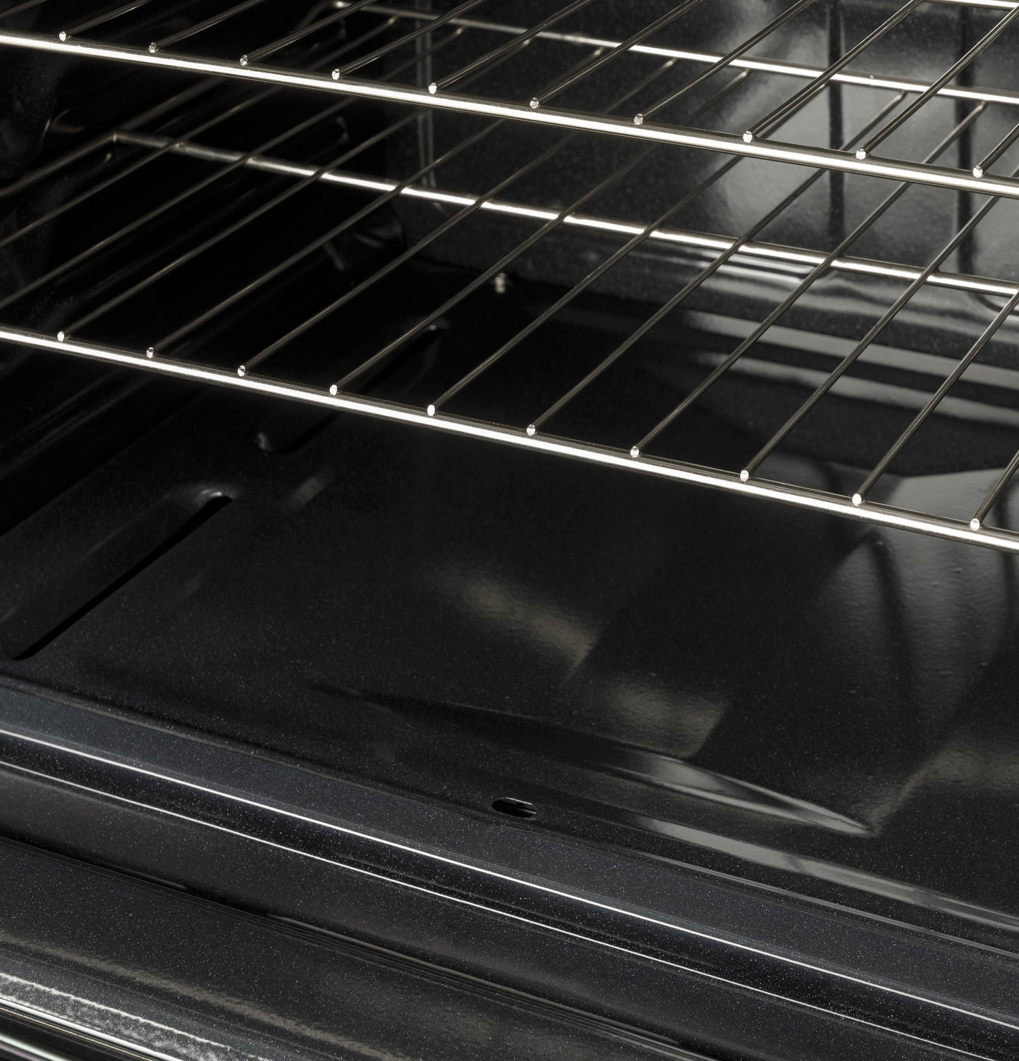 Interior view of oven cavity with metal racks in gas range from Ranges & Cooktops kitchen appliances collection