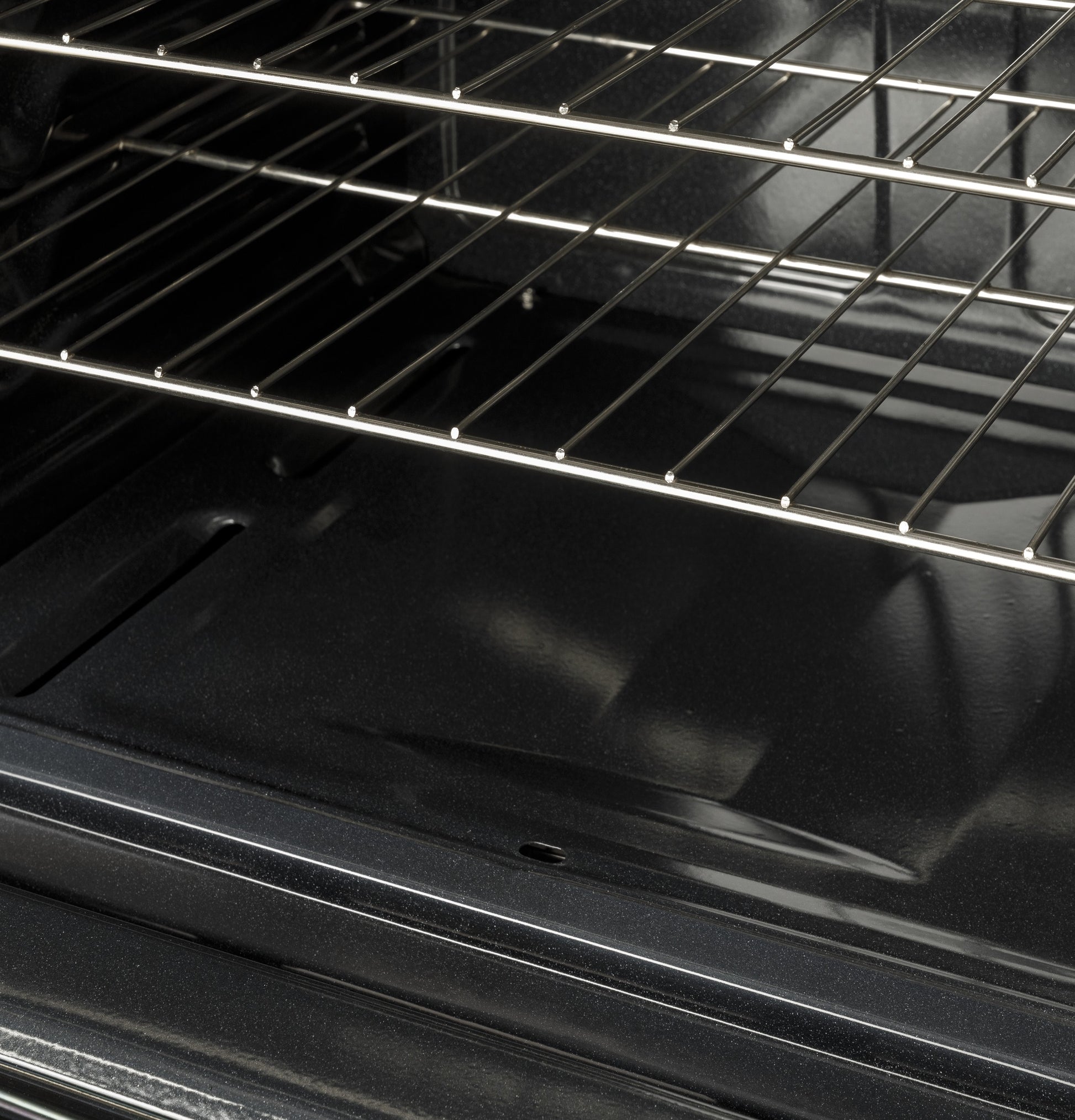 Interior view of oven cavity with metal racks in gas range from Ranges & Cooktops kitchen appliances collection