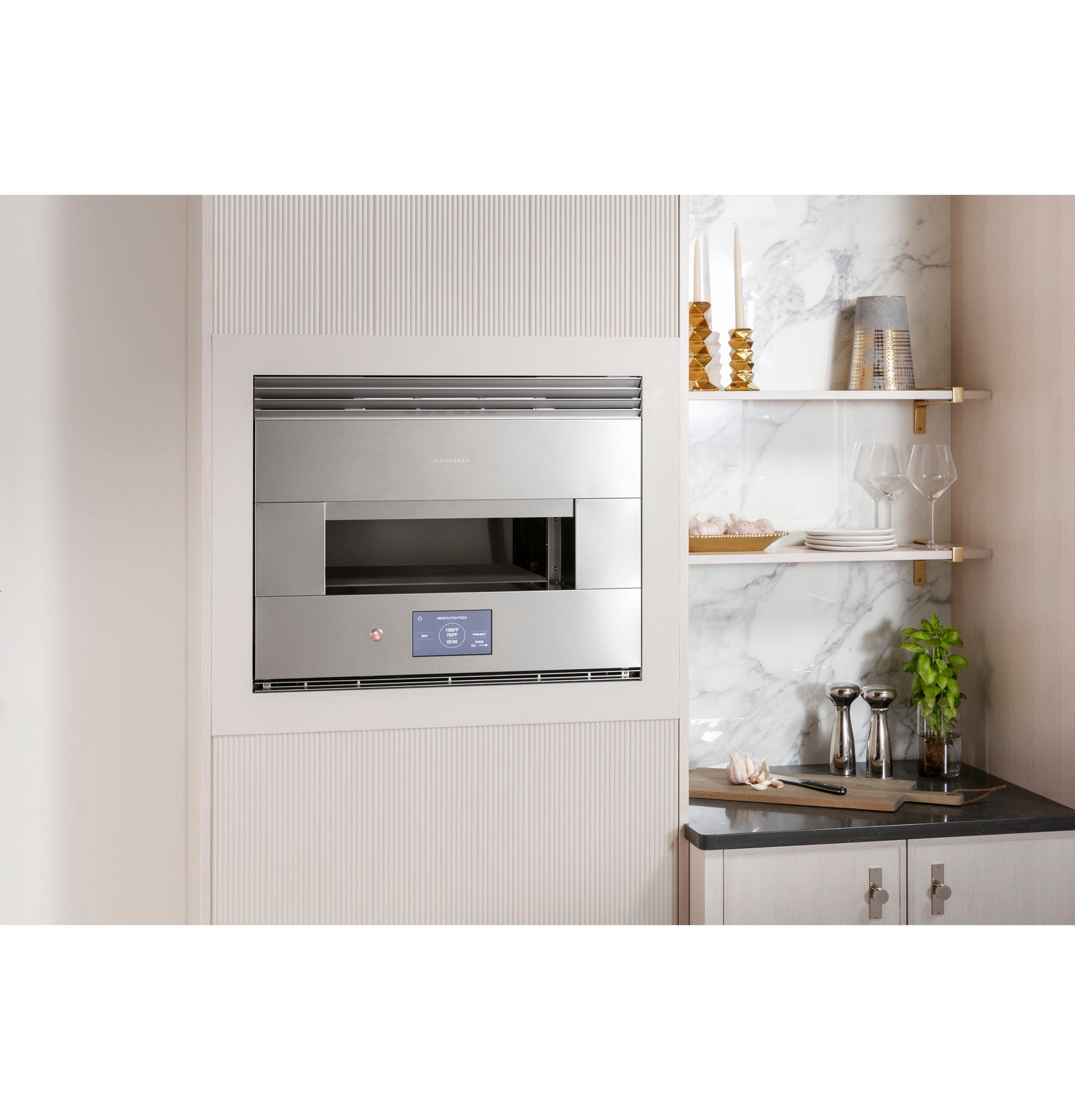 Built-in stainless steel hearth oven with digital touchscreen in modern kitchen with marble backsplash and shelving collections
