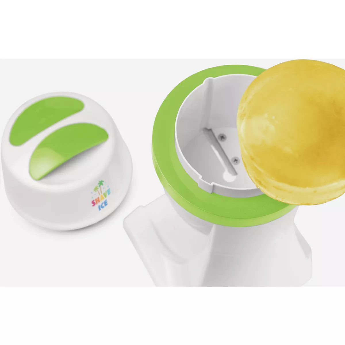 White and green electric shave ice machine with a block of ice ready for shaving on top
