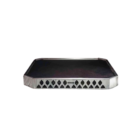 Steel fire pit base with patterned ventilation slots, designed for safe outdoor living and patio fire pits use