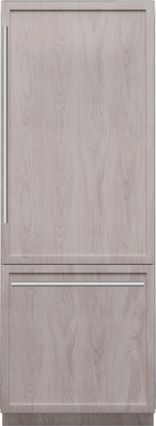 Built-in bottom freezer refrigerator with panel-ready wood finish and sleek metal handles in Thermador Appliances collection