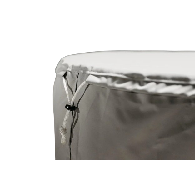 Close-up of light gray fire pit cover fabric with adjustable drawstring cord and black plastic toggle closure