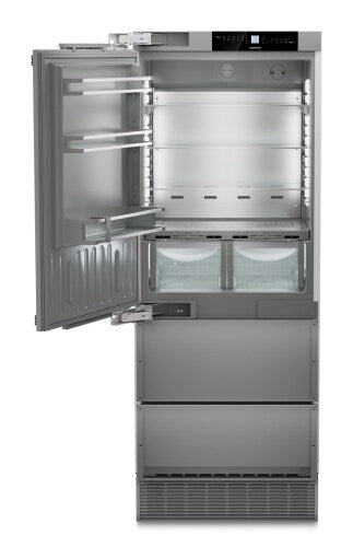 Built-in stainless steel refrigerator/freezer with digital display, adjustable shelves, and dual drawers in kitchen appliances collection