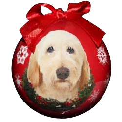 Red Christmas ornament featuring a yellow Labradoodle dog face with snowflake designs and a festive bow
