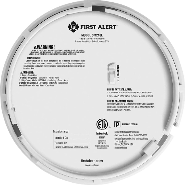 Back view of white First Alert photoelectric smoke alarm with model and safety instructions for home improvement use