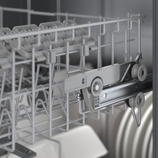 Close-up of adjustable upper rack with wheels and rails inside a white Bosch dishwasher from the kitchen appliance collection