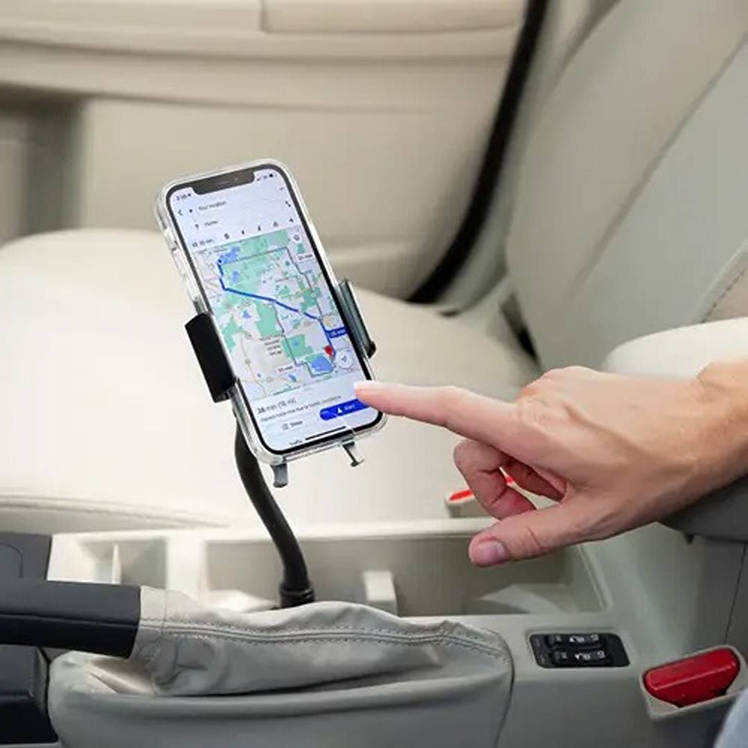 Flexible universal cup holder mount holding phone for hands-free navigation in vehicle, ideal for home improvement and electrical use under $50