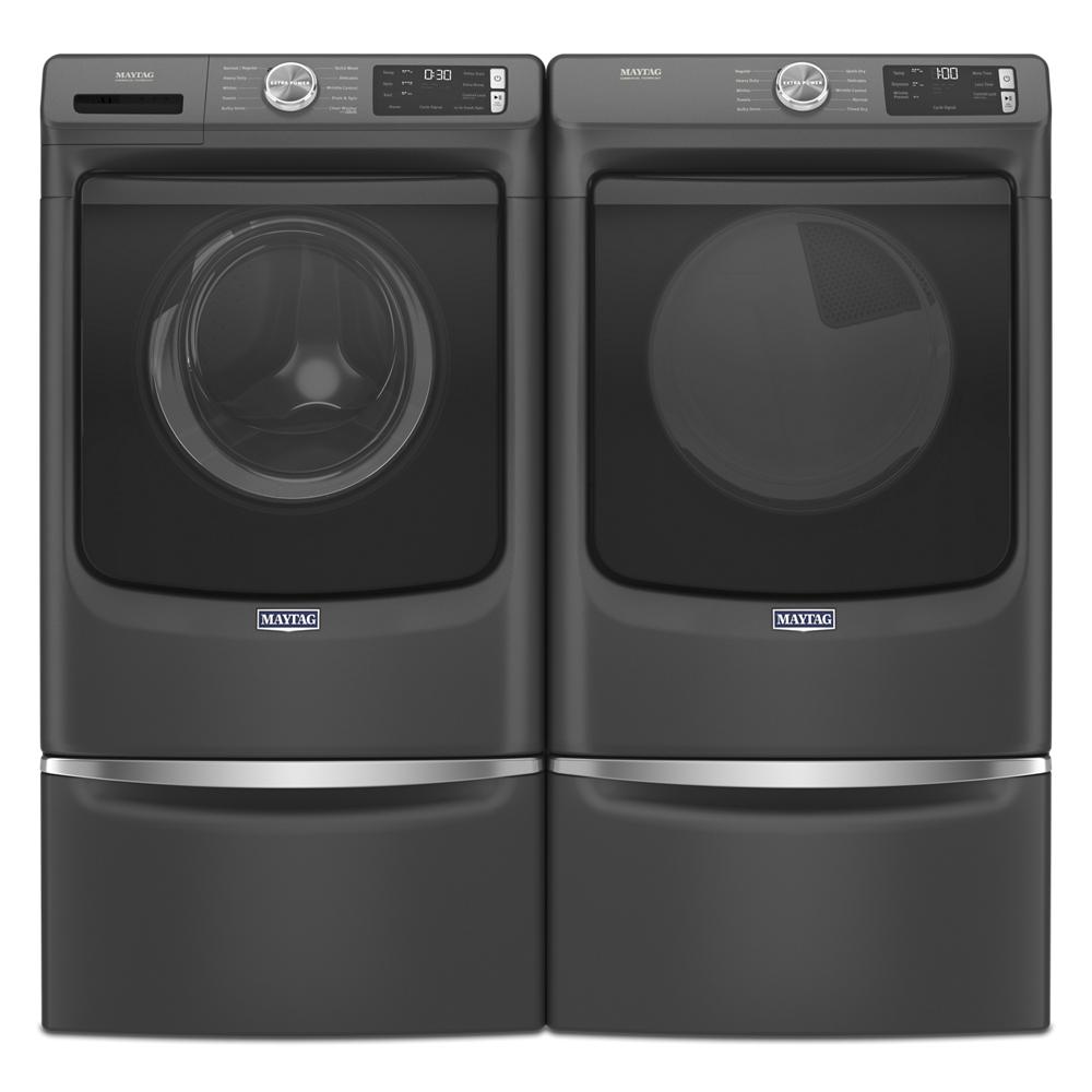 Set of dark gray front load washer and gas dryer with digital controls in modern home appliance collection.