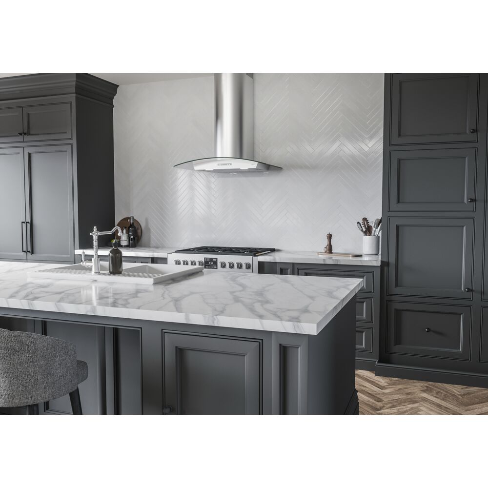 Stainless steel chimney hood with curved glass canopy, LED lighting, and touch controls in range hoods and kitchenware collection