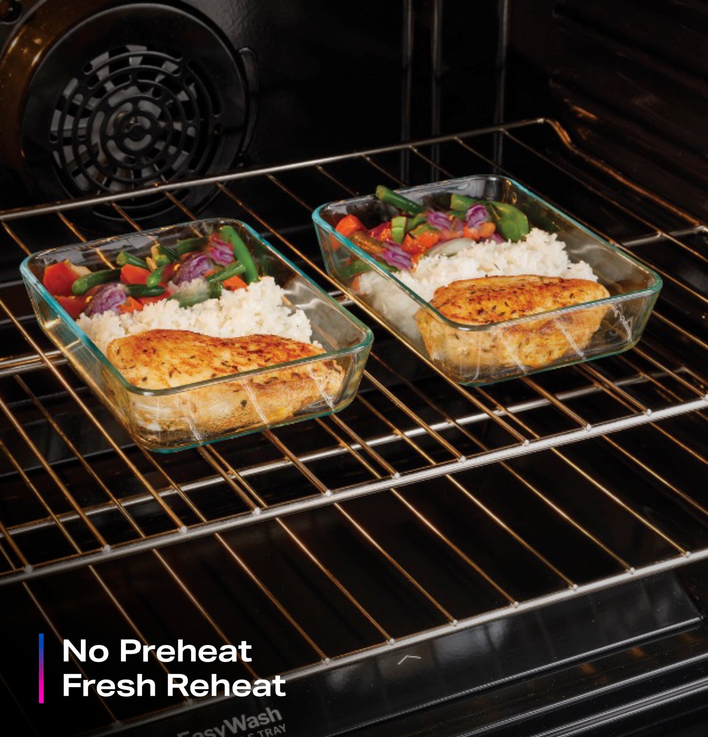 Two glass baking dishes with chicken, rice, and vegetables reheating inside a gas convection oven rack