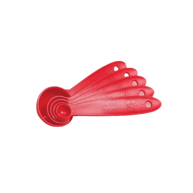 Set of five red lightweight measuring spoons in kitchen gadgets and tools for precise cooking measurements