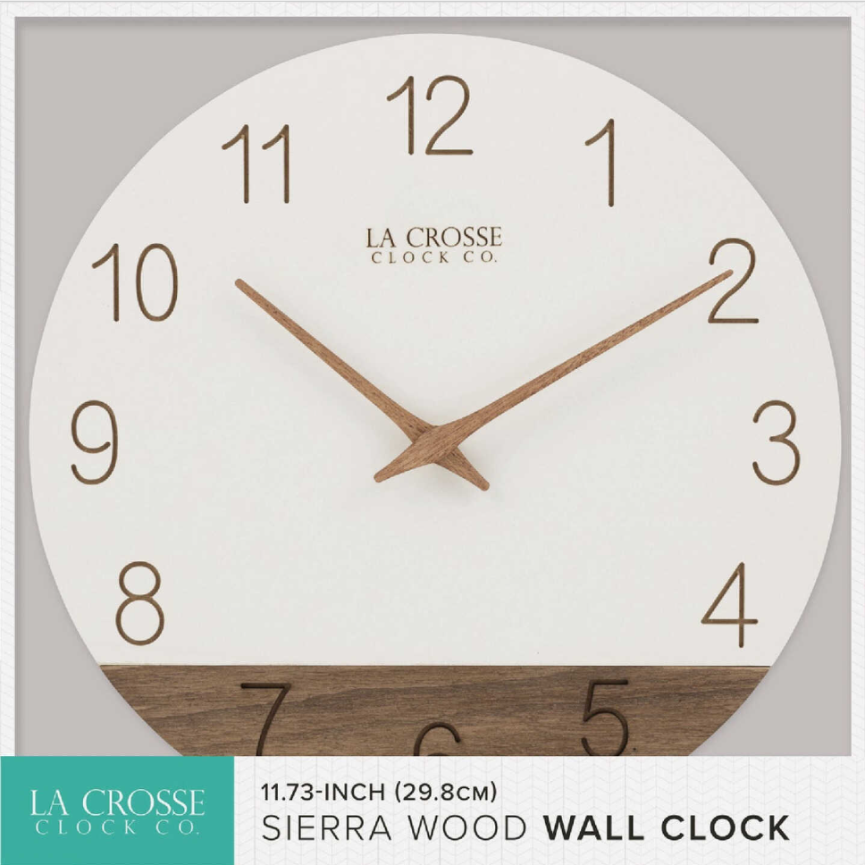 Round wall clock with laser-engraved brown numbers, wood hands, and partial wood accent for home decor collections.