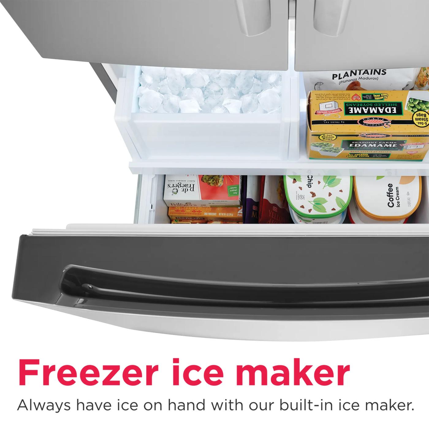 Open bottom freezer drawer showing built-in ice maker with ice and organized frozen foods inside refrigerator.