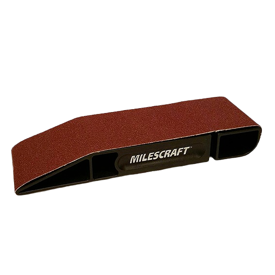 Compact sanding block with brown abrasive surface and black frame for abrasive and power tool accessories under $50