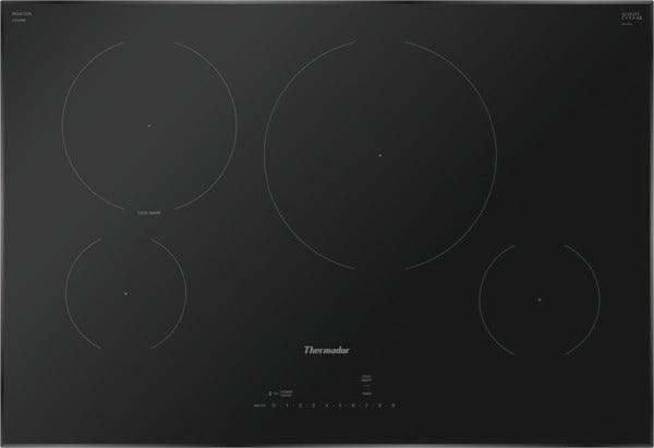 Black induction cooktop featuring four cooking zones with minimalist touch controls, part of Thermador appliances and kitchenware collections.