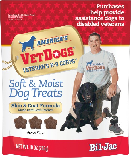 Red and white bag of soft and moist dog treats featuring a veteran with prosthetic leg and black service dog image