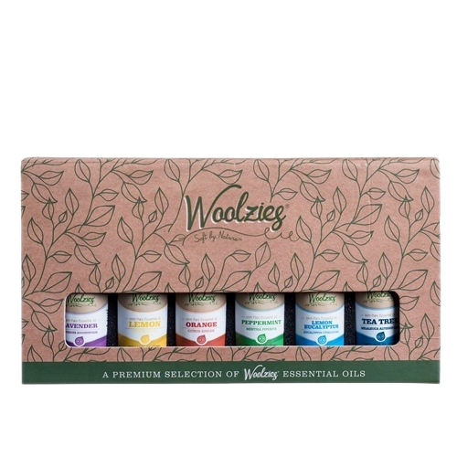 Set of six essential oils including lavender, lemon, orange, peppermint, lemon eucalyptus, and tea tree in decorative packaging