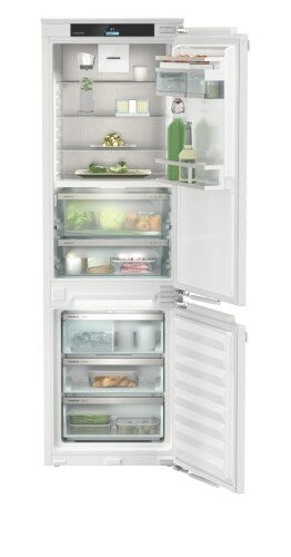Built-in 24-inch counter-depth refrigerator freezer with ice maker, glass shelves, and clear crisper drawers in appliances collection
