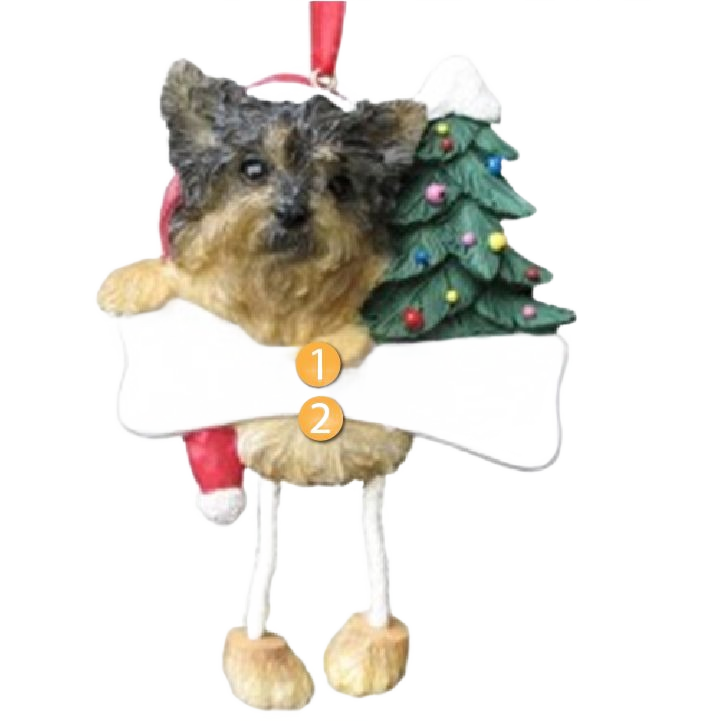 Personalized Yorkie ornament with dangling legs holding a bone and decorated Christmas tree for holiday décor under $50