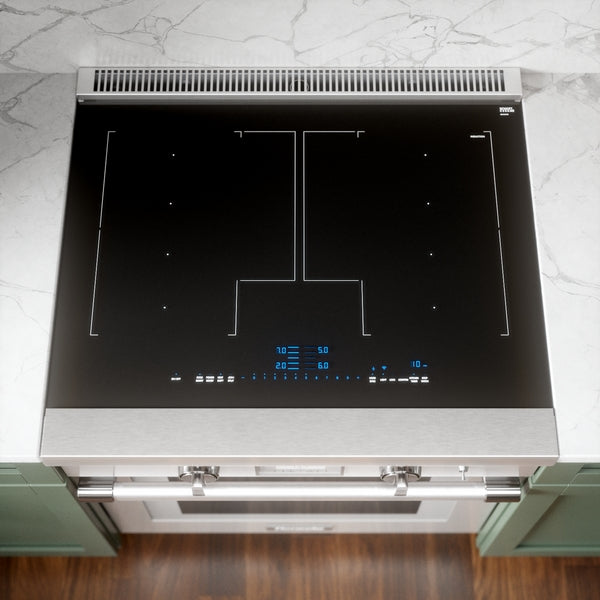 Top view of a stainless steel induction cooktop with digital controls set into a marble countertop in a modern kitchen setting
