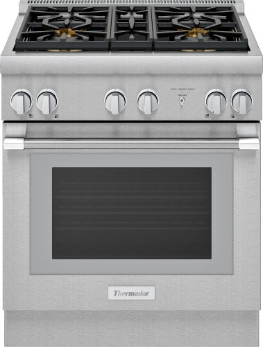 Stainless steel dual fuel range with six burner control knobs and large oven window in kitchen appliances collection