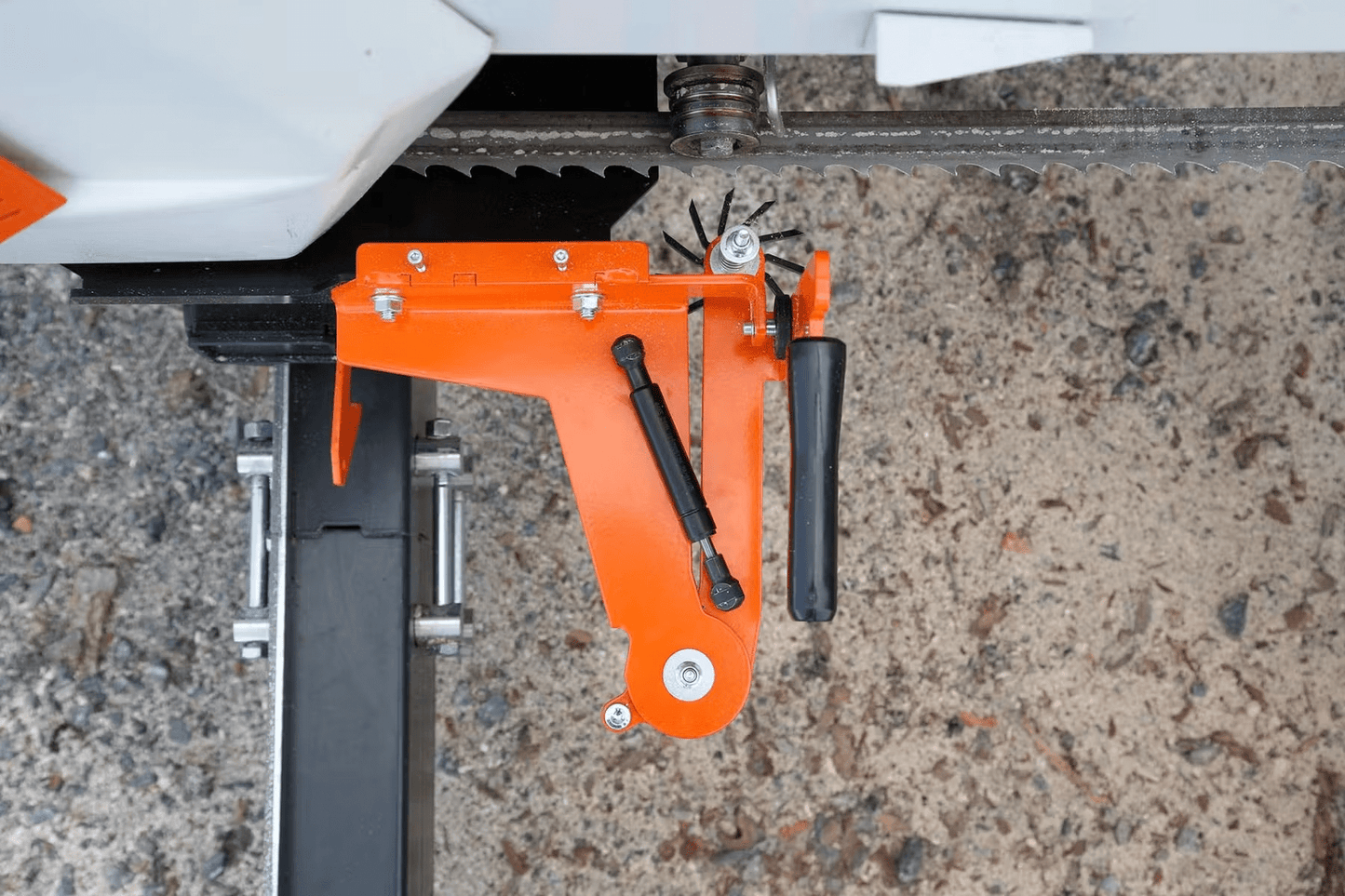Orange metal pre-cutter with black handle and patented cutting wheel for LOGOSOL band sawmill tool accessories collections