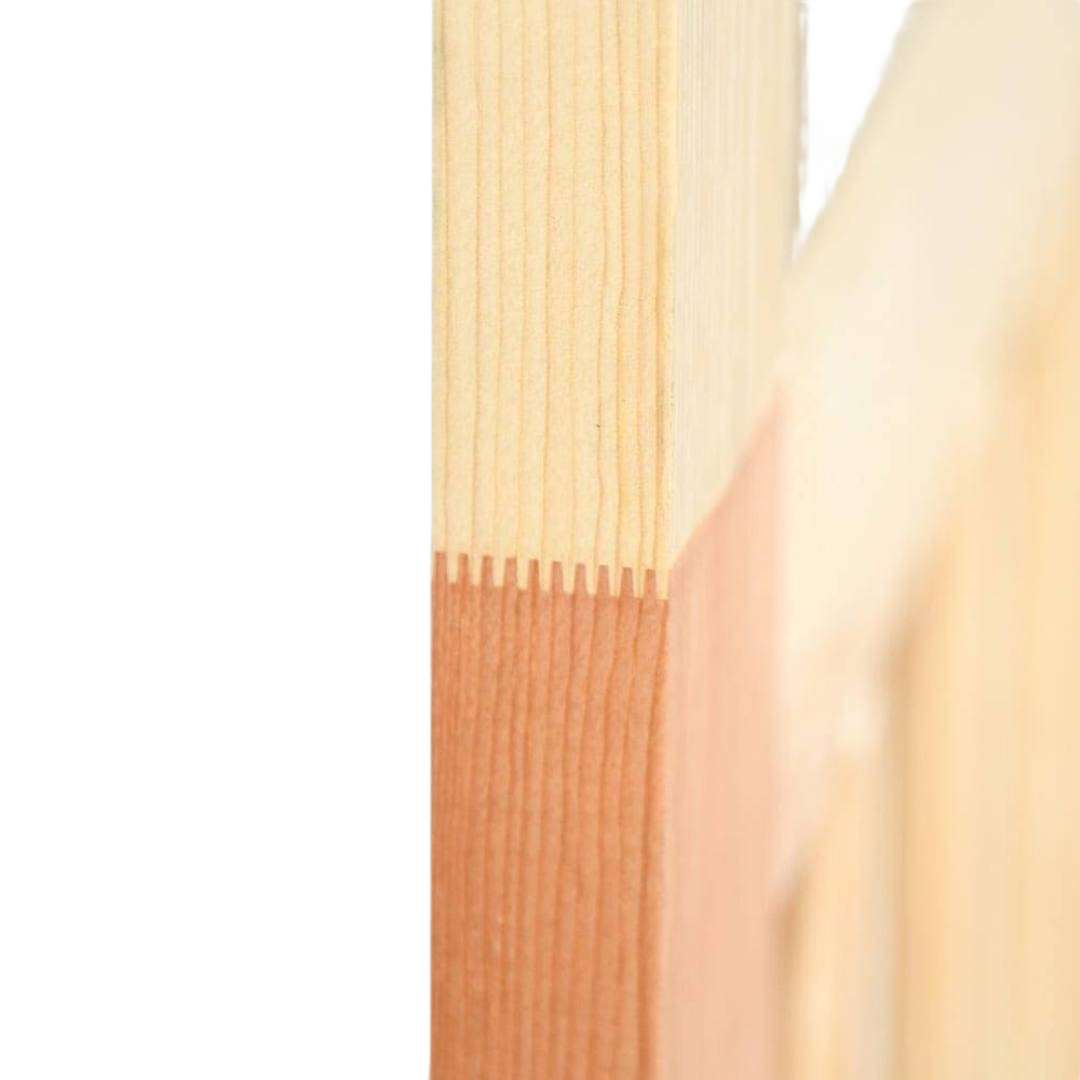 Close-up of interlocking natural wood joints on a T-bar style screen door frame for home improvement projects