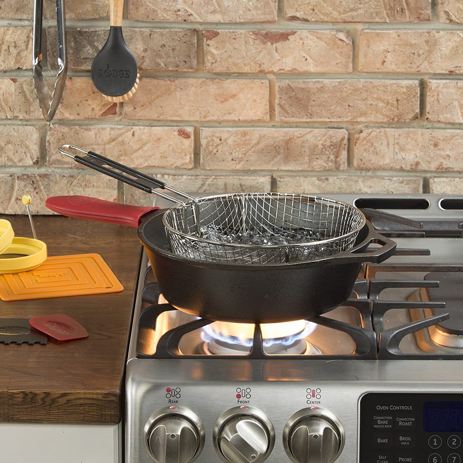 Black cast iron deep skillet with frying basket on gas stove in kitchenware and Lodge cast iron collections under $50