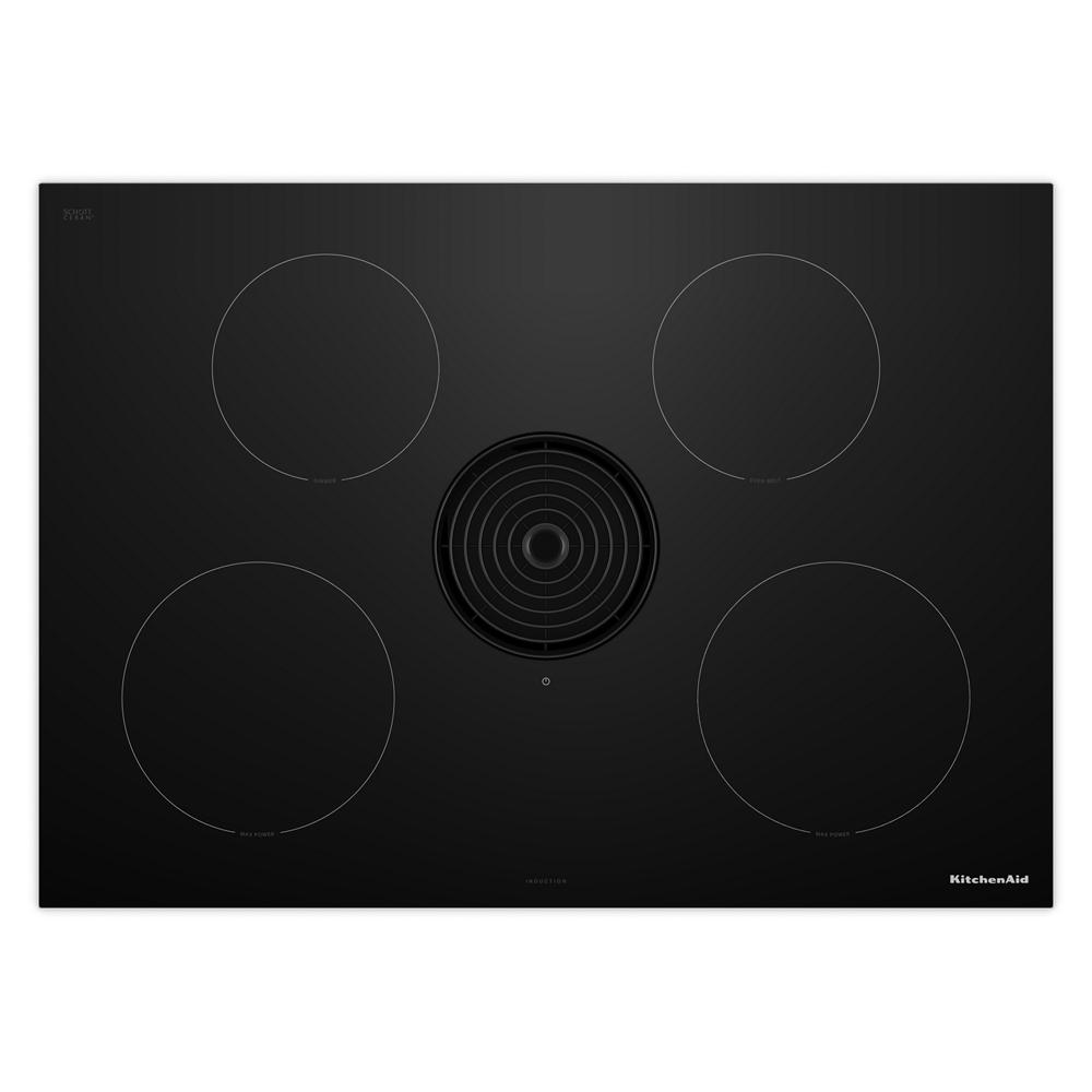 Sleek black induction cooktop with four cooking zones and downdraft vent in KitchenAid appliances collection
