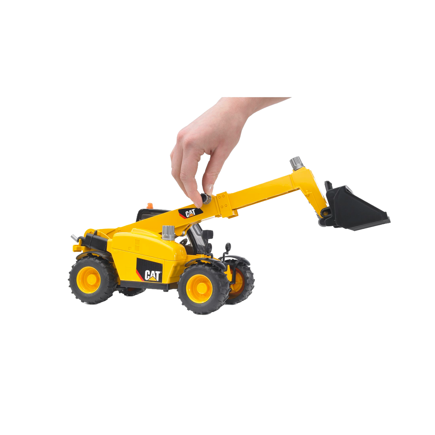 Hand manipulating yellow Bruder 02142 CAT Telehandler toy with extendable arm and bucket in vehicles and toys collection